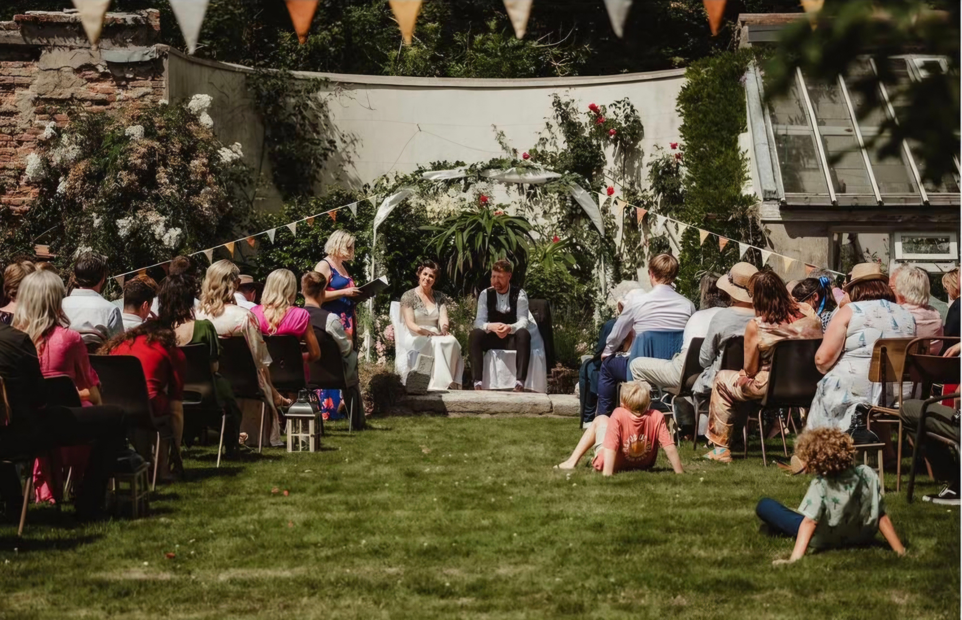 Loved ones gathered for a small garden wedding