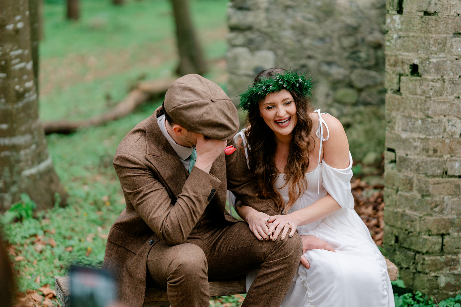 Rachel and Chandler sharing a moment together among trees and old stone walls